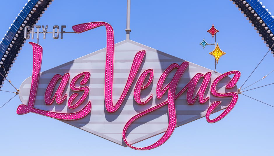 The famous Las Vegas sign with vibrant colors against a clear sky, a must-see landmark.